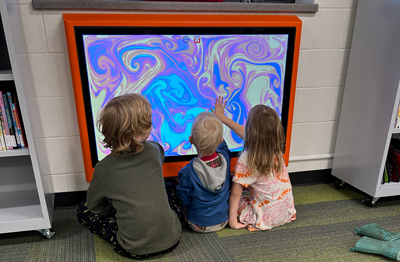 3 toddlers interacting with Touch2Play Kidzpace